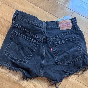 Levi's mid waist distressed black shorts